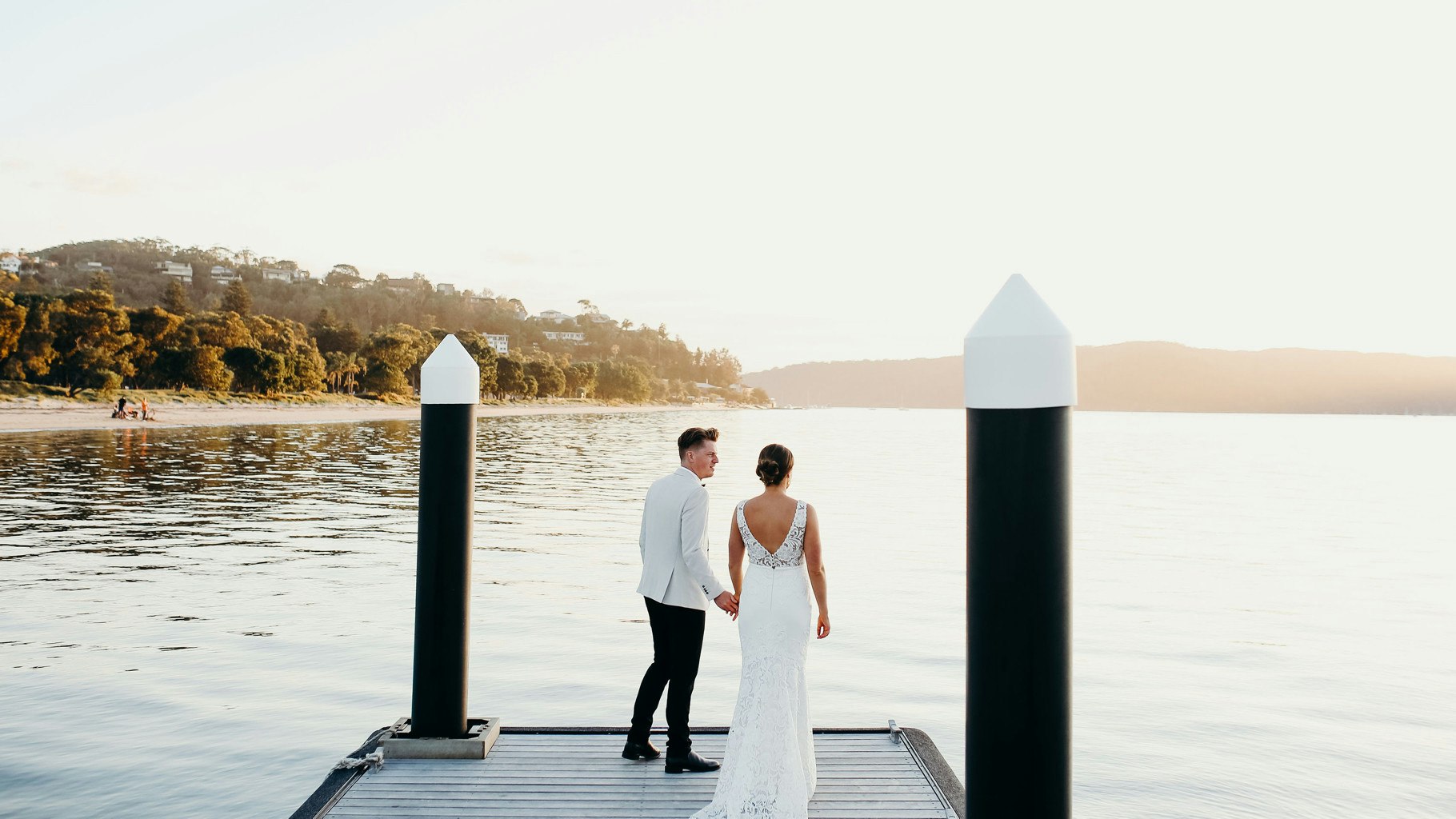 Wedding couple at the end of a jetty.